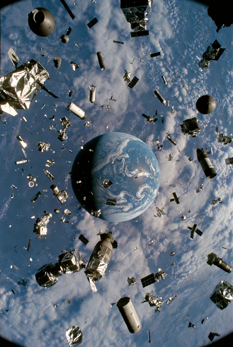 A photograph of Earth from space with orbiting metallic objects, including satellites and debris.