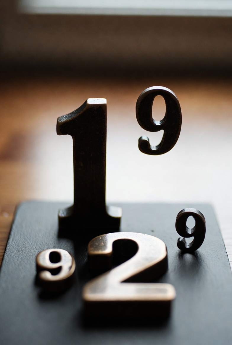 A photograph illustrating scientific notation with numbers and powers of ten in a simple, clear style.